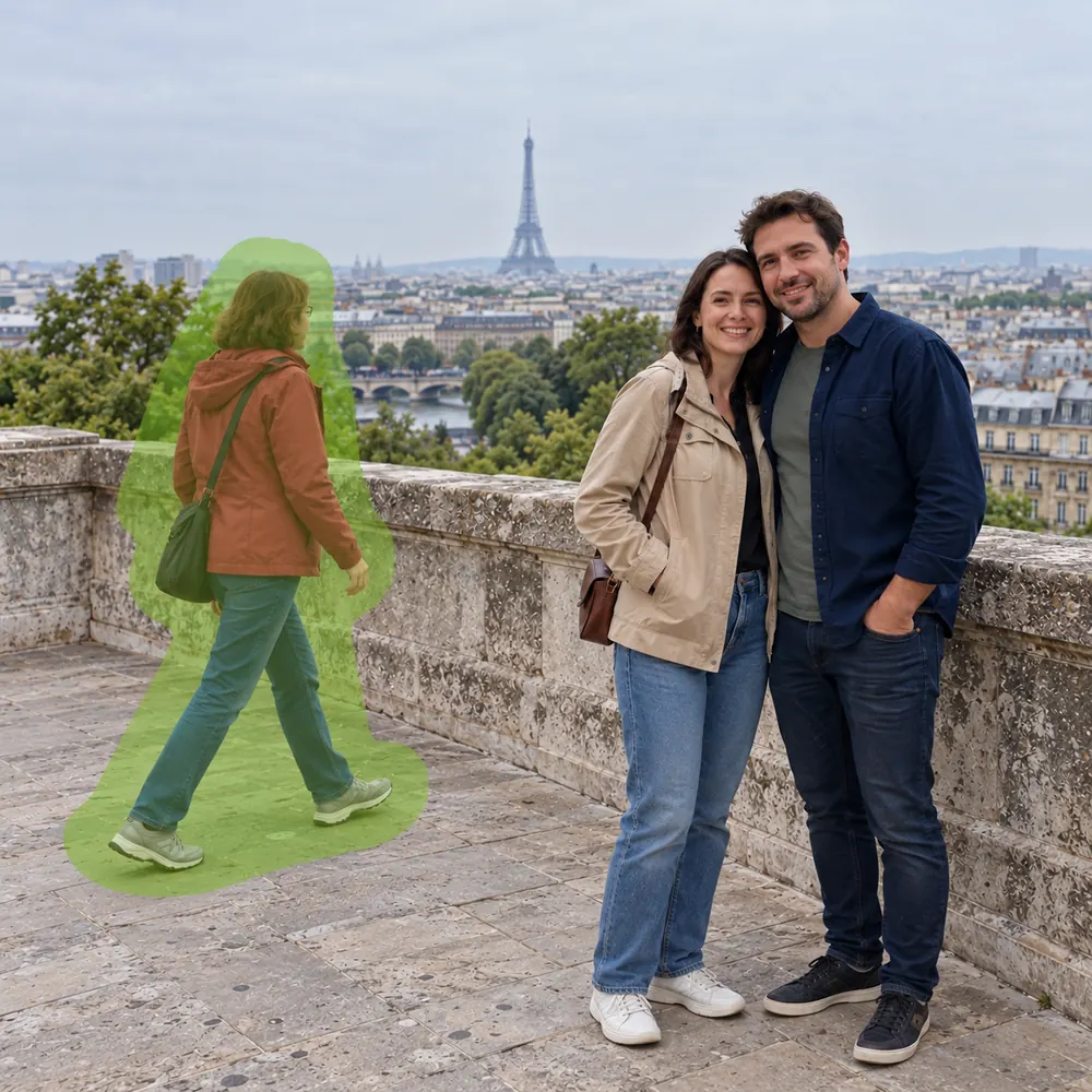 Couple posing at a scenic overlook with wandering tourists cluttering the panoramic background.